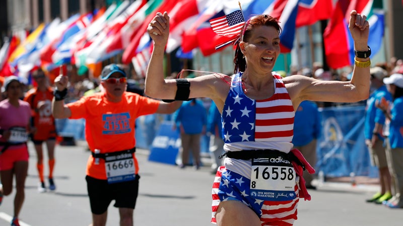 Cynthia Cirri, of New Jersey, crosses the finish line of the 118th Boston Marathon Monday, April 21, 2014.