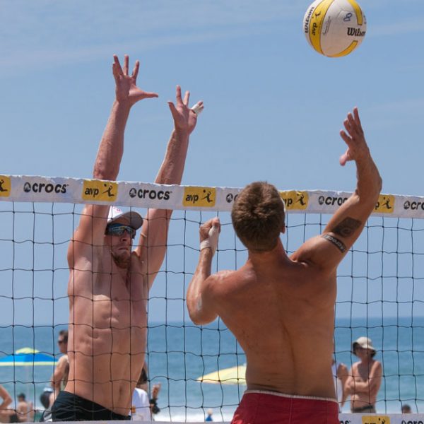 MANHATTAN BEACH California Mike Placek spikes the ball Austin Rester attempts to block him AVP Manhattan Beach Open