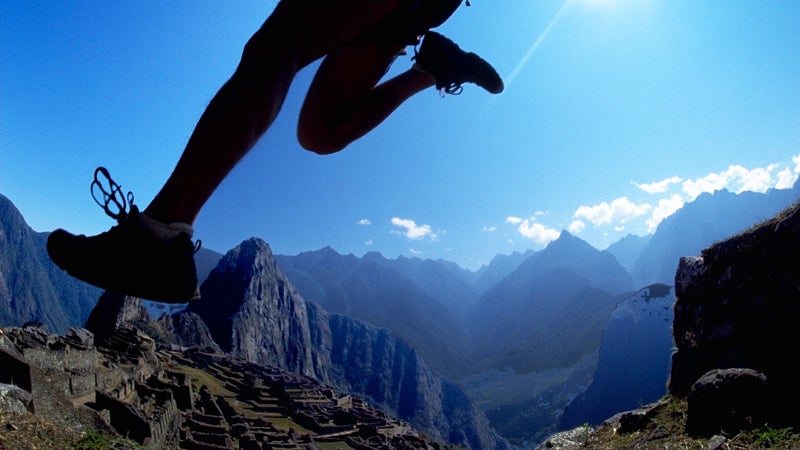 A runner enters Machu Picchu during the Andes Adventures Inca Trail Marathon.