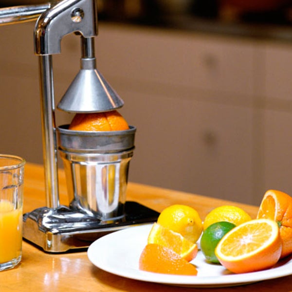 indoor nobody small group of objects juicer glass fruit oranges orange juice plate slices kitchen fresh food preparation selective focus copy space