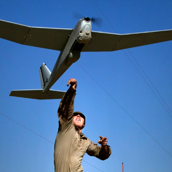 A Marine launches a Puma AE by throwing it in the air. The first drone approved by commercial use with BP is also popular with the military.