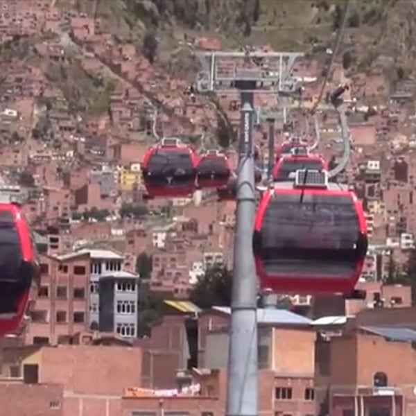 OutsideOnline gondola Bolivia La Paz El Alton commute 10-minute 30-minute swing swings 13 615-foot congested roadway alternative Dopplemayer ANF Noticias Fides YouTube Bolivians operates transports six miles spans hours-a-day commuters-an-hour commuters