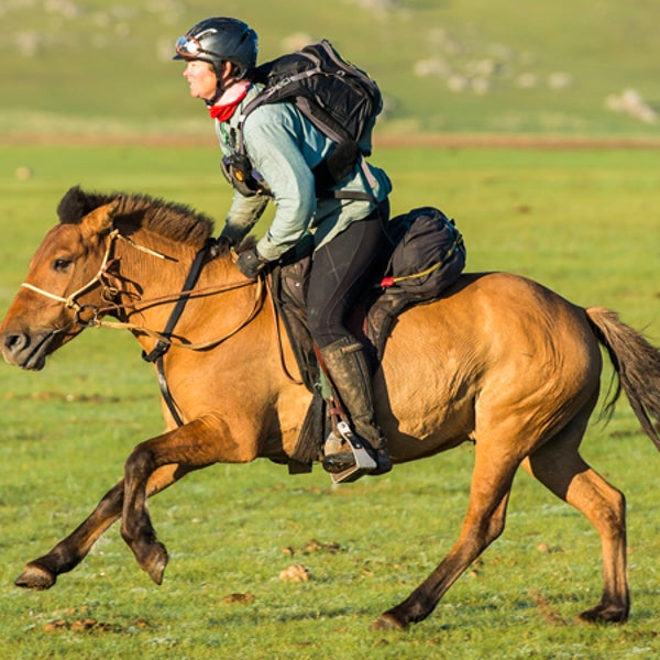 Sam Jones takes helps train rescue horses in her spare time at home in Australia.