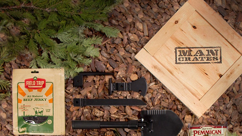 OutsideOnline survival crate Mancrates outdoor $99 wooden crate trunk shovel ice pick saw paracord knife blanket glow sticks cooking pot stove meal bar beef jerky crowbar large