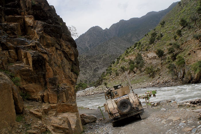 A humvee heads up the Kunar Riv