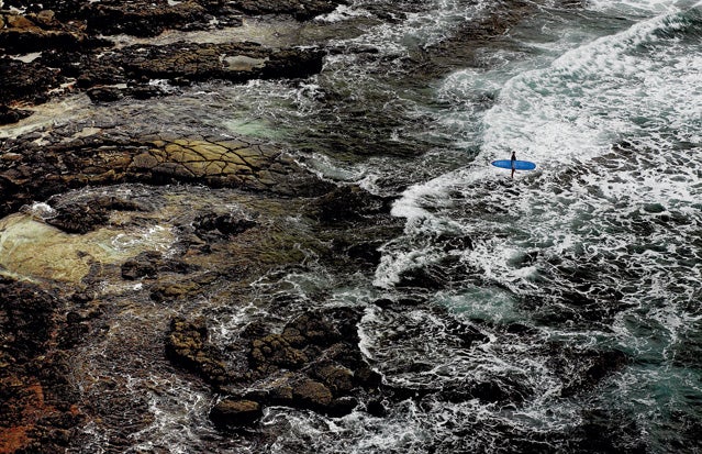 A surfer on shore