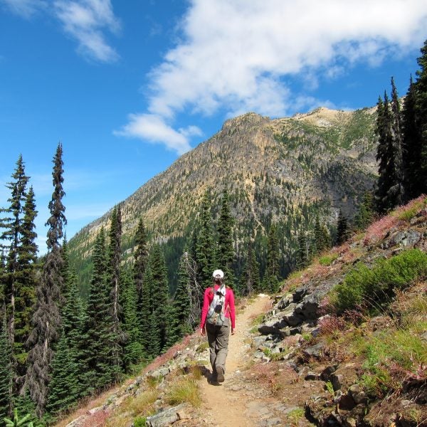 A hiker makes her way through Cutthroat Pass, a section of the Pacific Crest Trail.